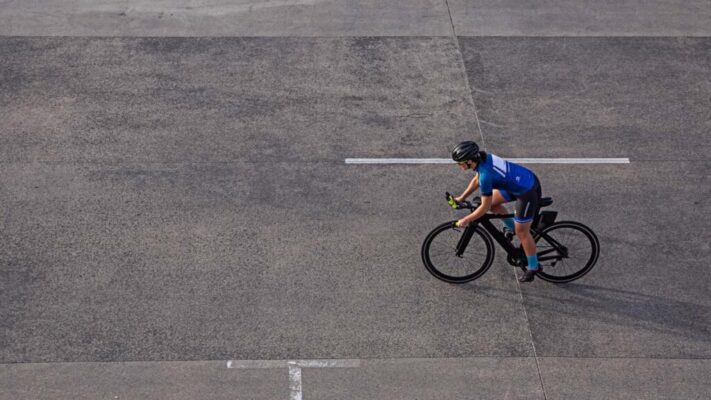 Triathlete maintaining steady pace during triathlon cycling leg.